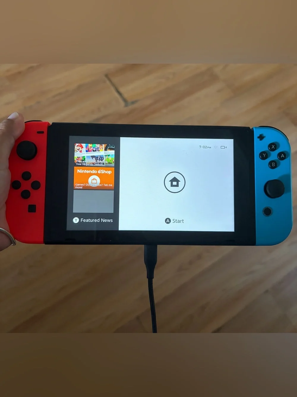 Nintendo Switch with Neon Red & Neon Blue Joy‑Con and Five Games